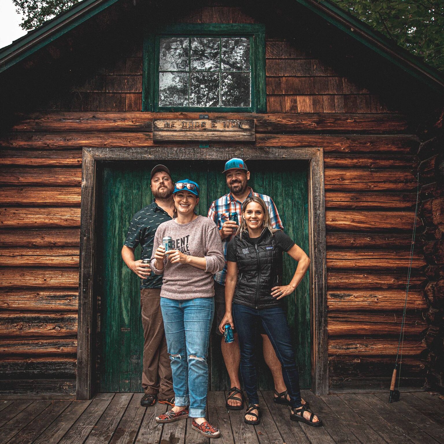 Bent Paddle Brewing Co-Founders in front of cabin