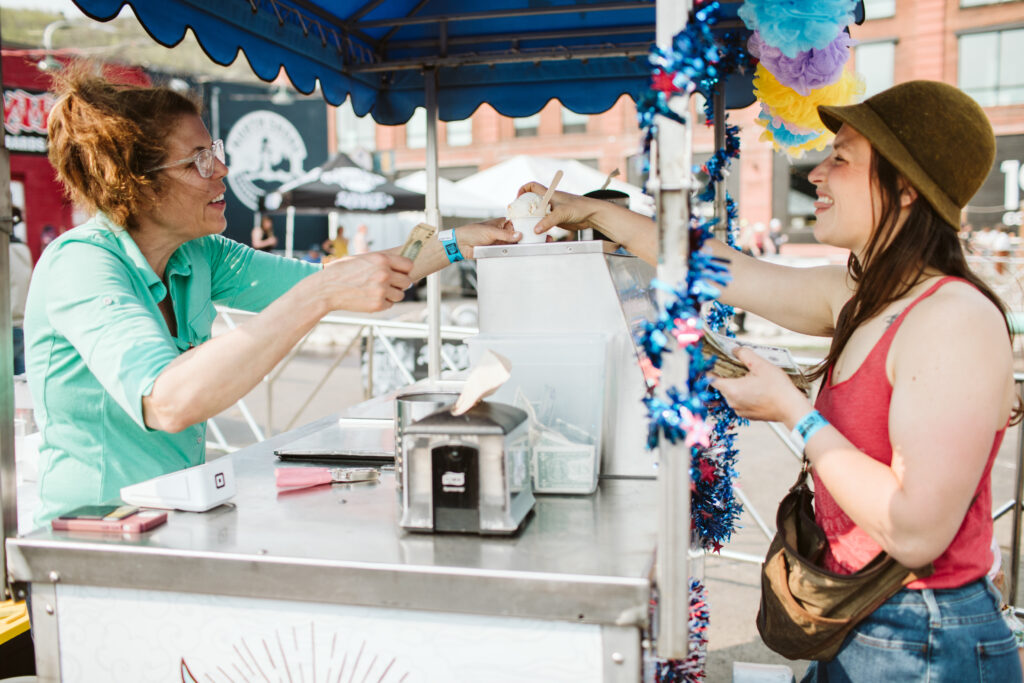 woman purchasing ice cream from Love Creamery ice cream cart
